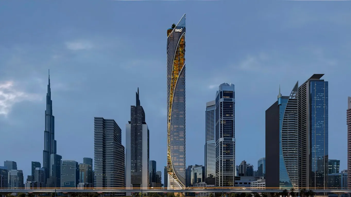 The tower rising above the Sheikh Zayed Road skyline, with Burj Khalifa to its left
